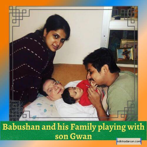Babushan playing with his son Gwan